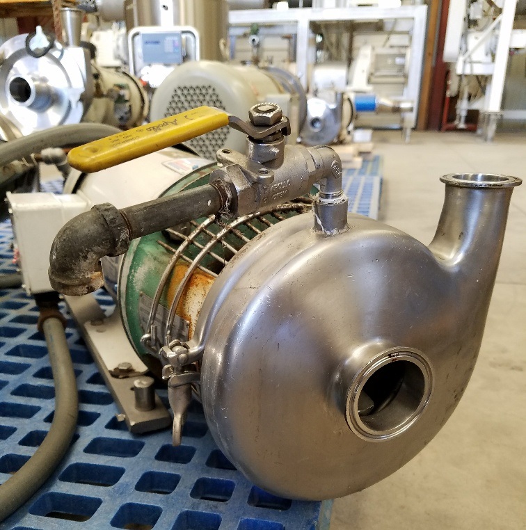 TRI CLOVER sanitary centrifugal pump Model C216MD18T-S driven by 5 HP, 3450 RPM.  Stainless Steel. Previously used in sanitary food and beverage plant.
